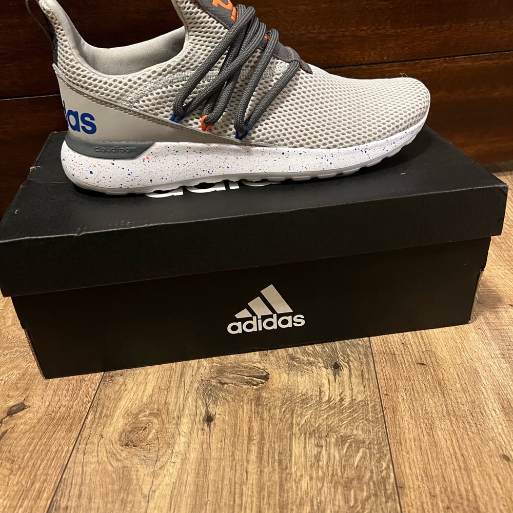 New with box Adidas no tie tennis shoes. Size 6 youth. Color is grey.